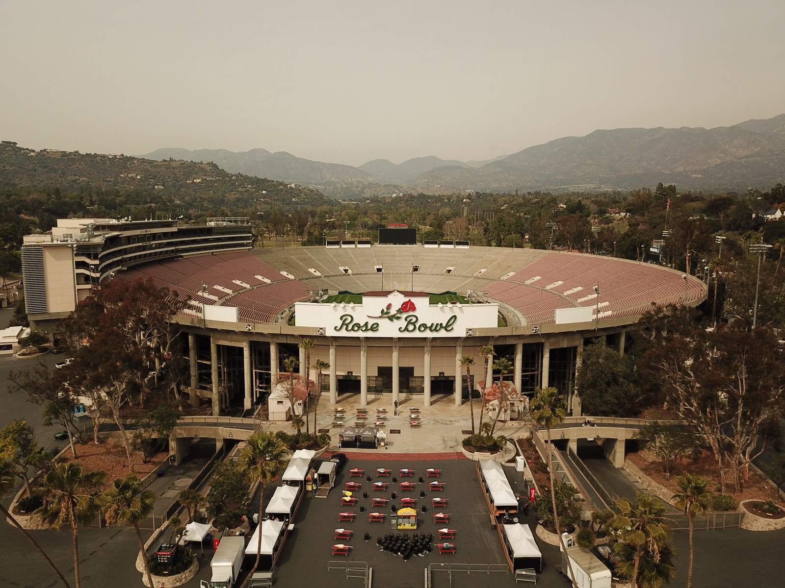 Rose Bowl Stadium seen from the south with its entrance sign and hills behind